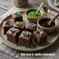 Steamed ragi dhokla cubes with green chutney and tamarind chutney from Kiro 3-in-1 finger millet premix
